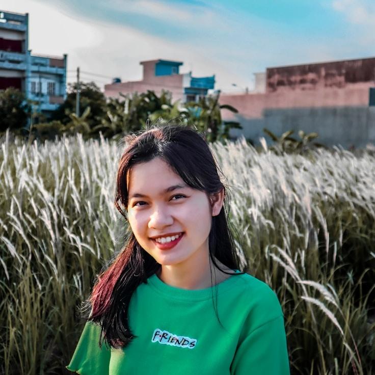 Kaveri Mehta, Lead Design Curator at TapestryFoundryPath, reviewing corporate floral arrangements